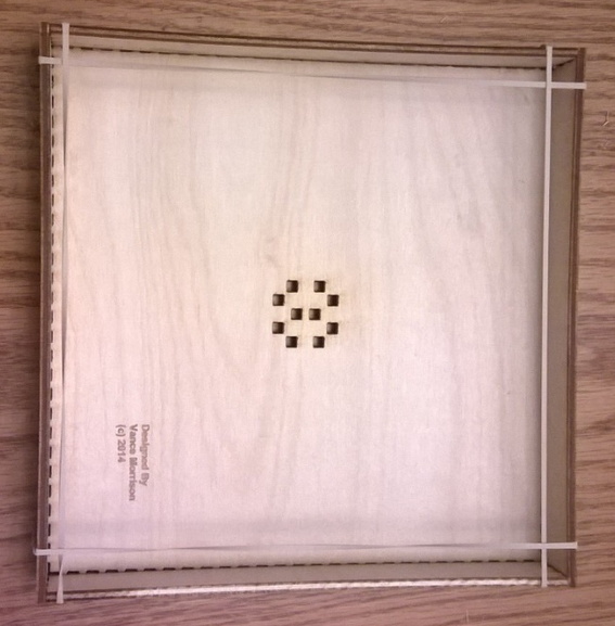 Tray held with rubber bands